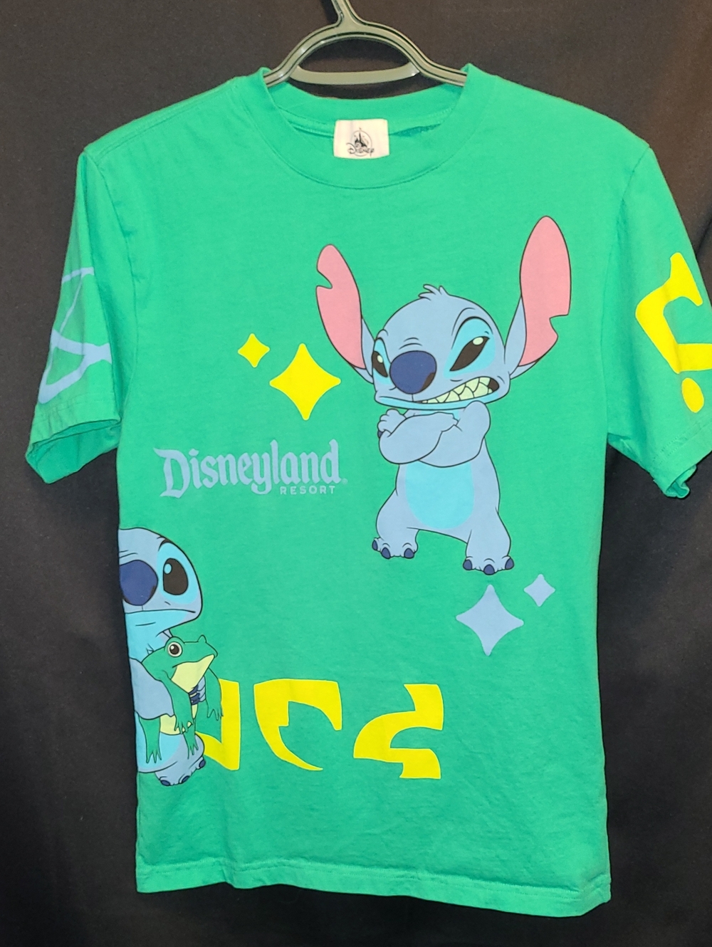 Disney Parks shirt features a graphic of Stitch from Lilo & Stitch